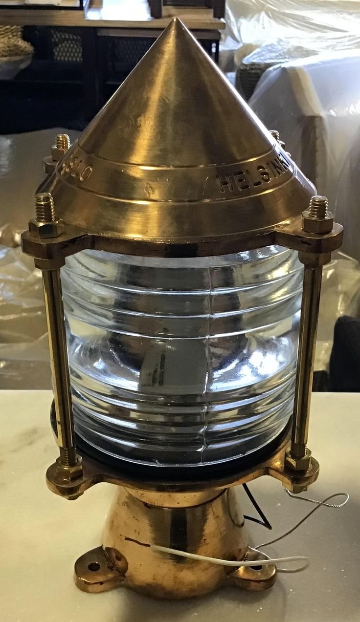 Brass post light with a glass lens