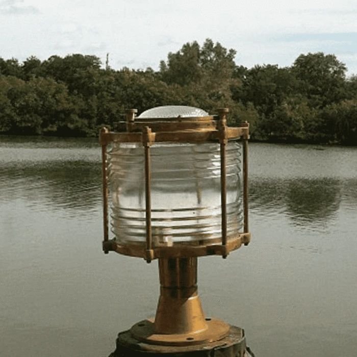 Post-mounted nautical light beside a lake