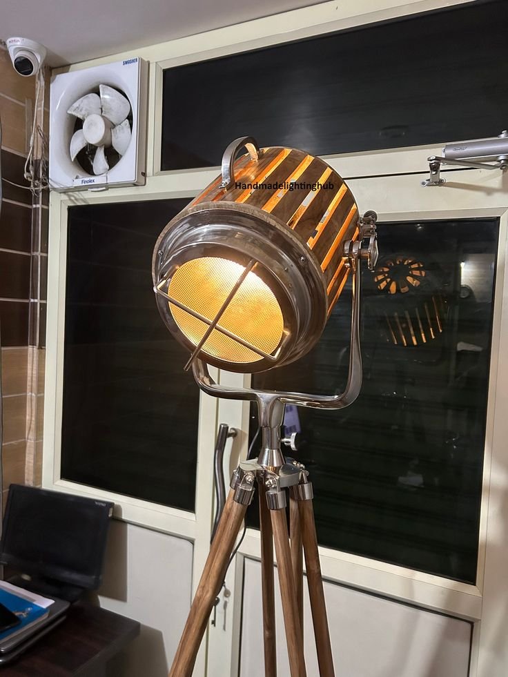 Vintage spotlight on a wooden tripod