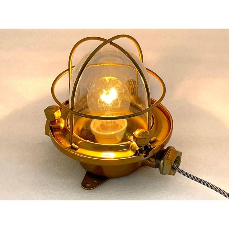 Lit brass cage light