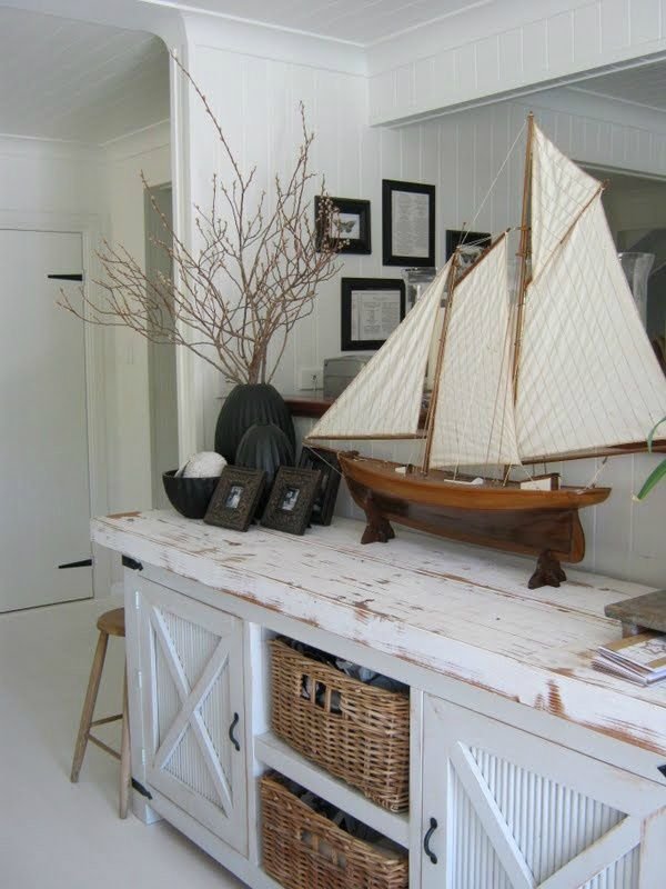 Sideboard styled with model sailing ships