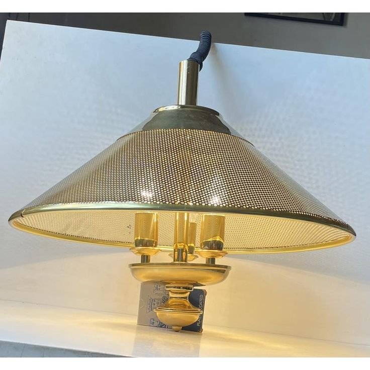 Brass nautical light with a glass shade