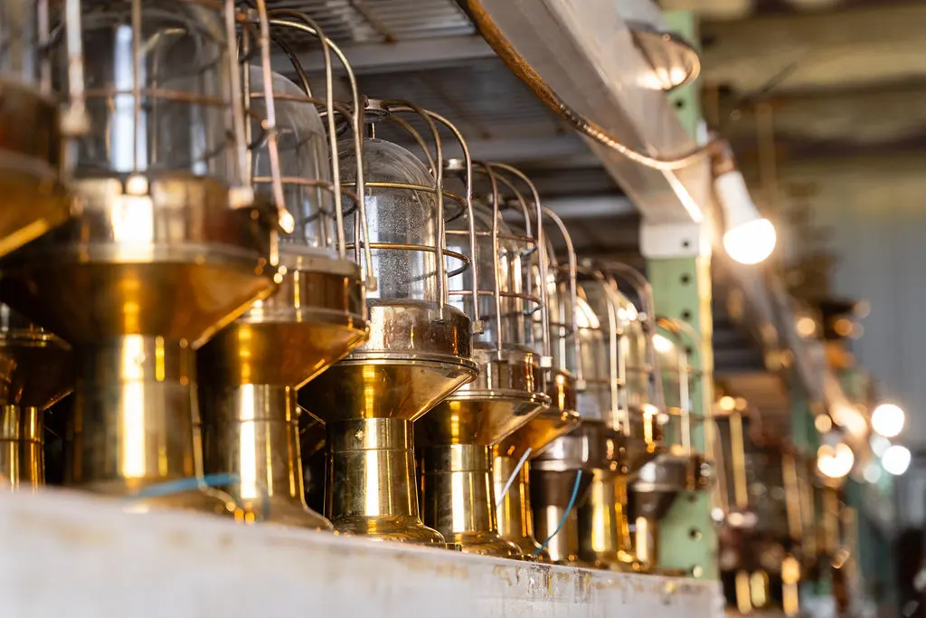 A row of restored brass nautical lanterns